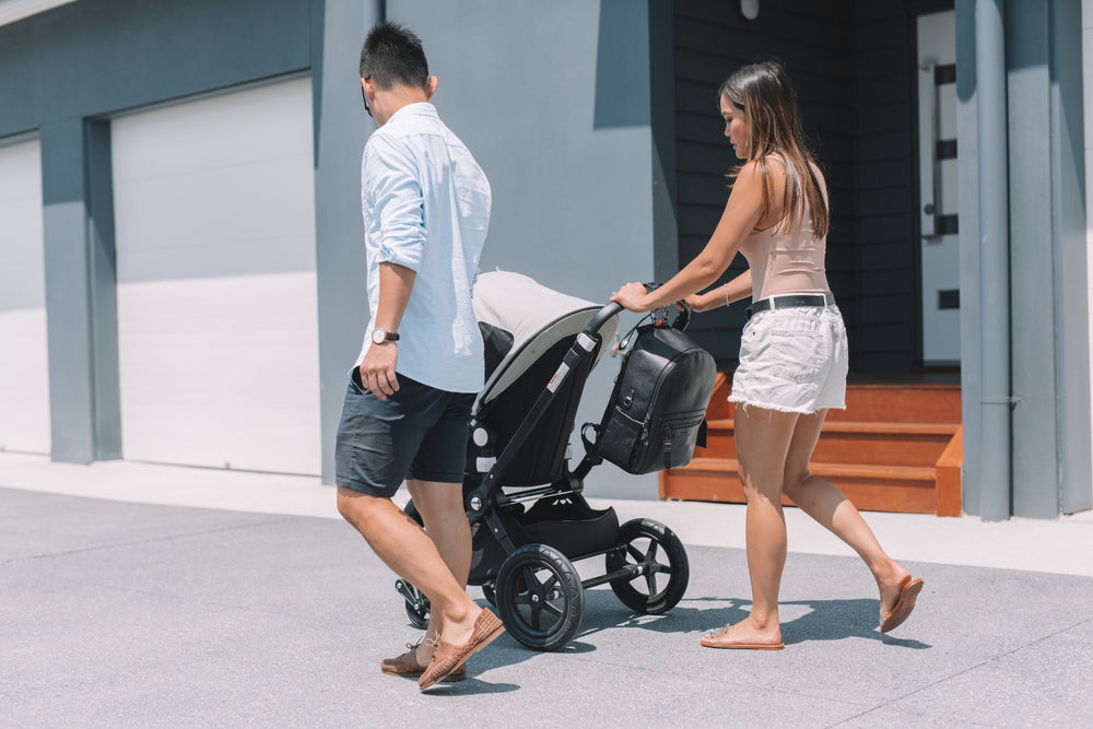 Parents walking with Stroller with ONE NINE Pram Clips